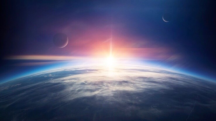 宇宙から見た地球の地平線と、そこから昇る太陽